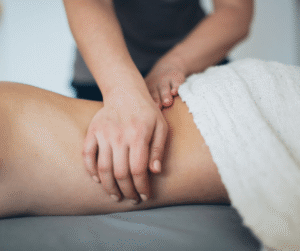 Someone getting a deep lower back massage at The Calla Clinic, Derbyshire