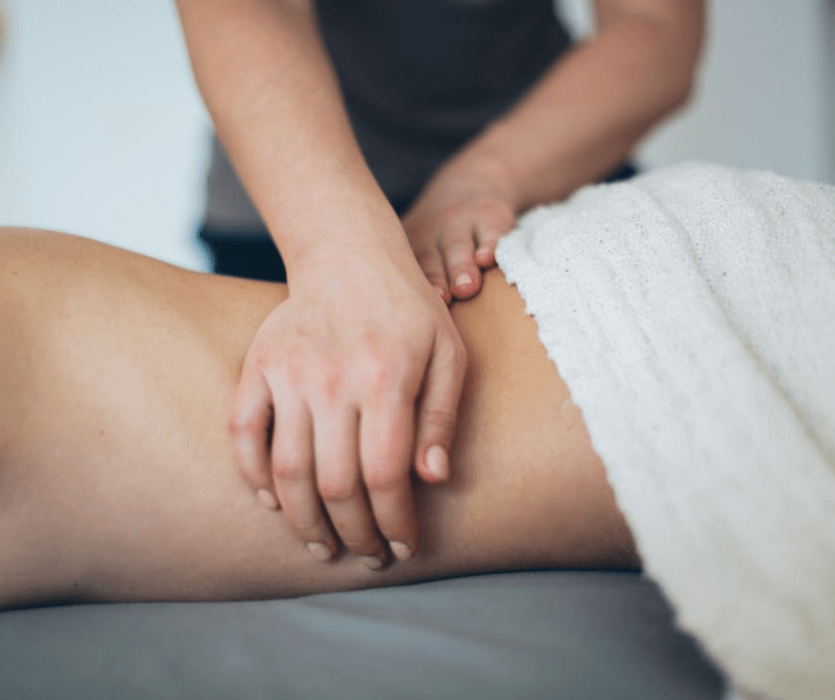 Someone getting a deep lower back massage at The Calla Clinic, Derbyshire