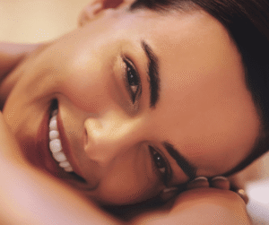 Woman smiling after cog thread lift