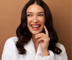 woman smiling with glowing skin