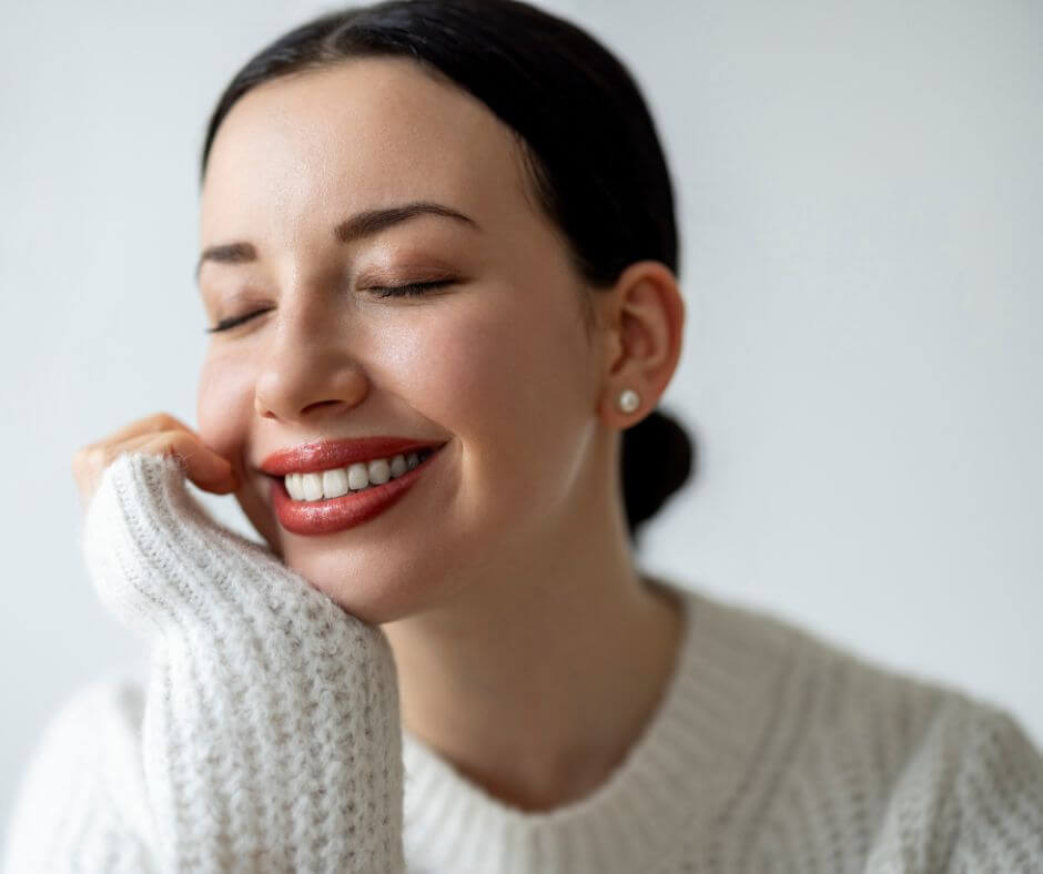 woman smiling with her ideal dermal filler results after following good aftercare